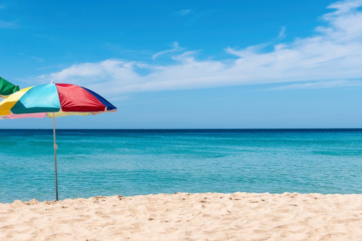 a flag on a sandy beach