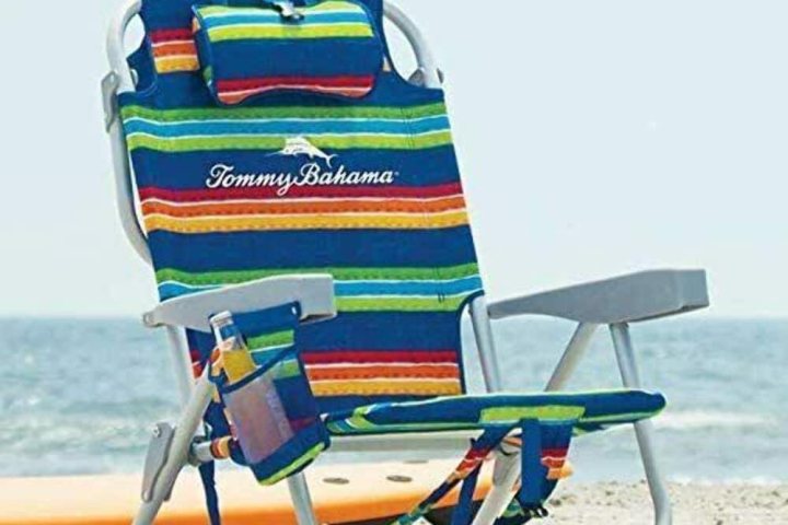 a chair sitting in front of a beach